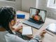 ethnic girl having video chat with teacher online on laptop